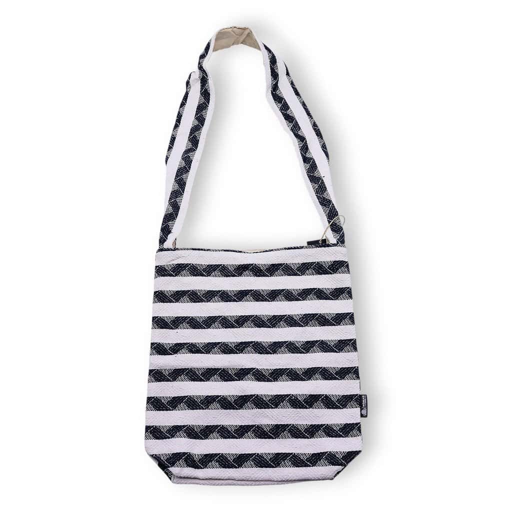Striped fabric tote bag with adjustable shoulder strap for everyday use and casual outings.