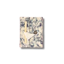 Handmade paper travel kit with wooden stick and sewing needle, stylish for travel and organisation.